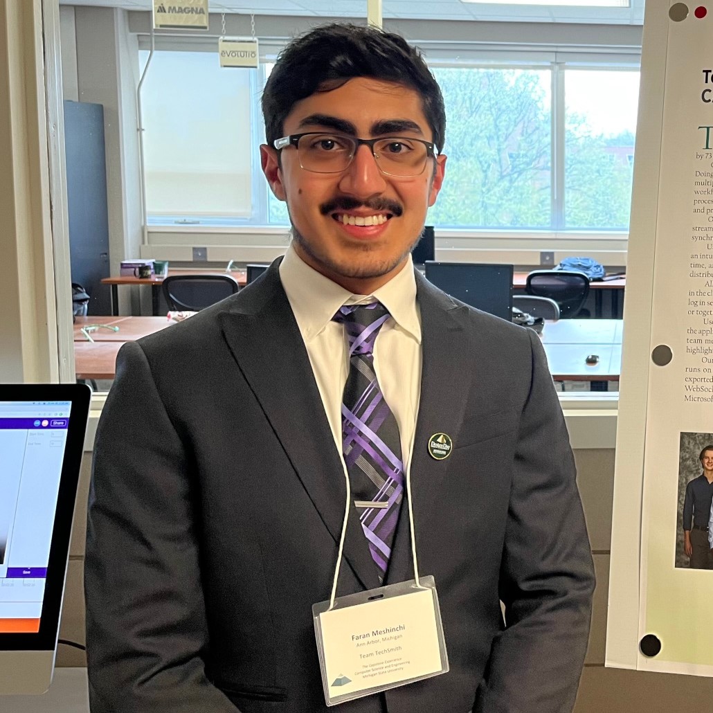 Profile Picture of Adrián Moreno (@zetxek), working side by side with a colleague: sitting on a desk, while looking at a screen